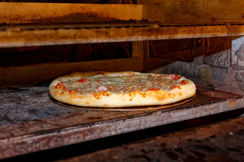 Dion's signature Supreme pizza loaded with toppings